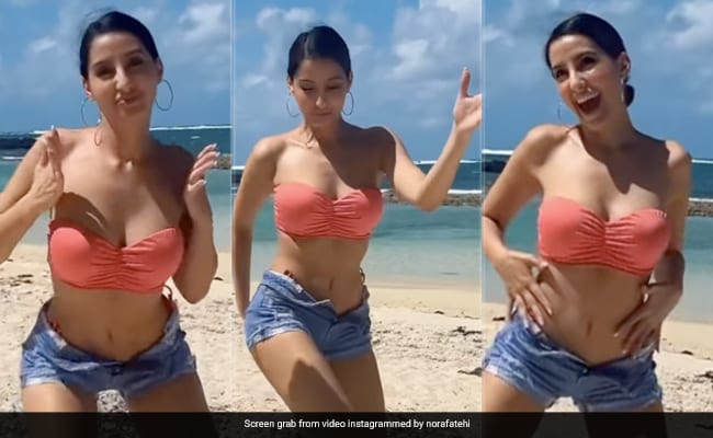 Nora Fatehi's Latest Photos: Red Bikini And Beach Relaxation Nora Fatehi's Latest Photos: Red Bikini And Beach Relaxation